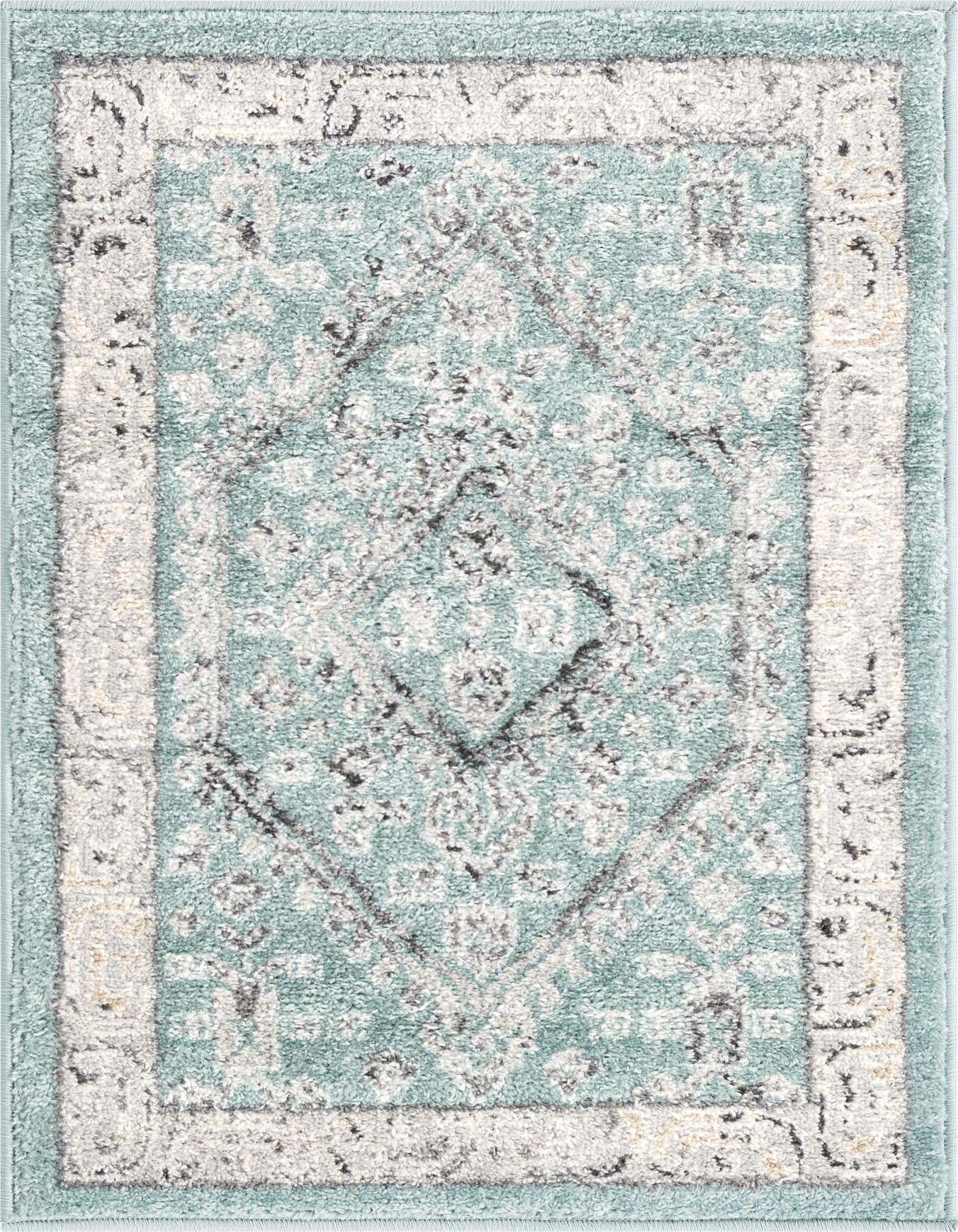 A 2x3 rectangular Aurelia rug with a traditional medallion pattern in shades of blue, grey, and white.