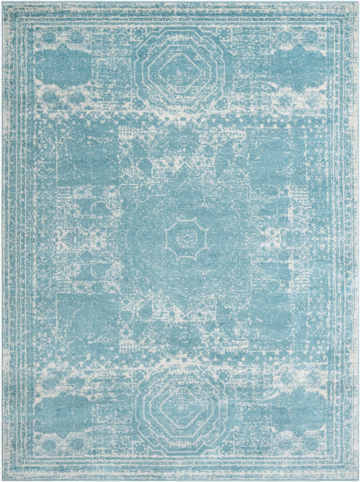 A 9x12 rectangular area rug featuring a distressed traditional pattern in varying shades of blue and white.