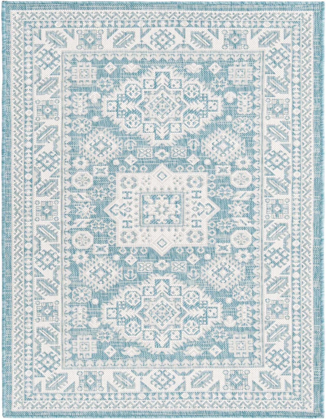 A 3x5 rectangular indoor/outdoor rug featuring a light blue and white Southwestern tribal pattern with a flatweave texture.
