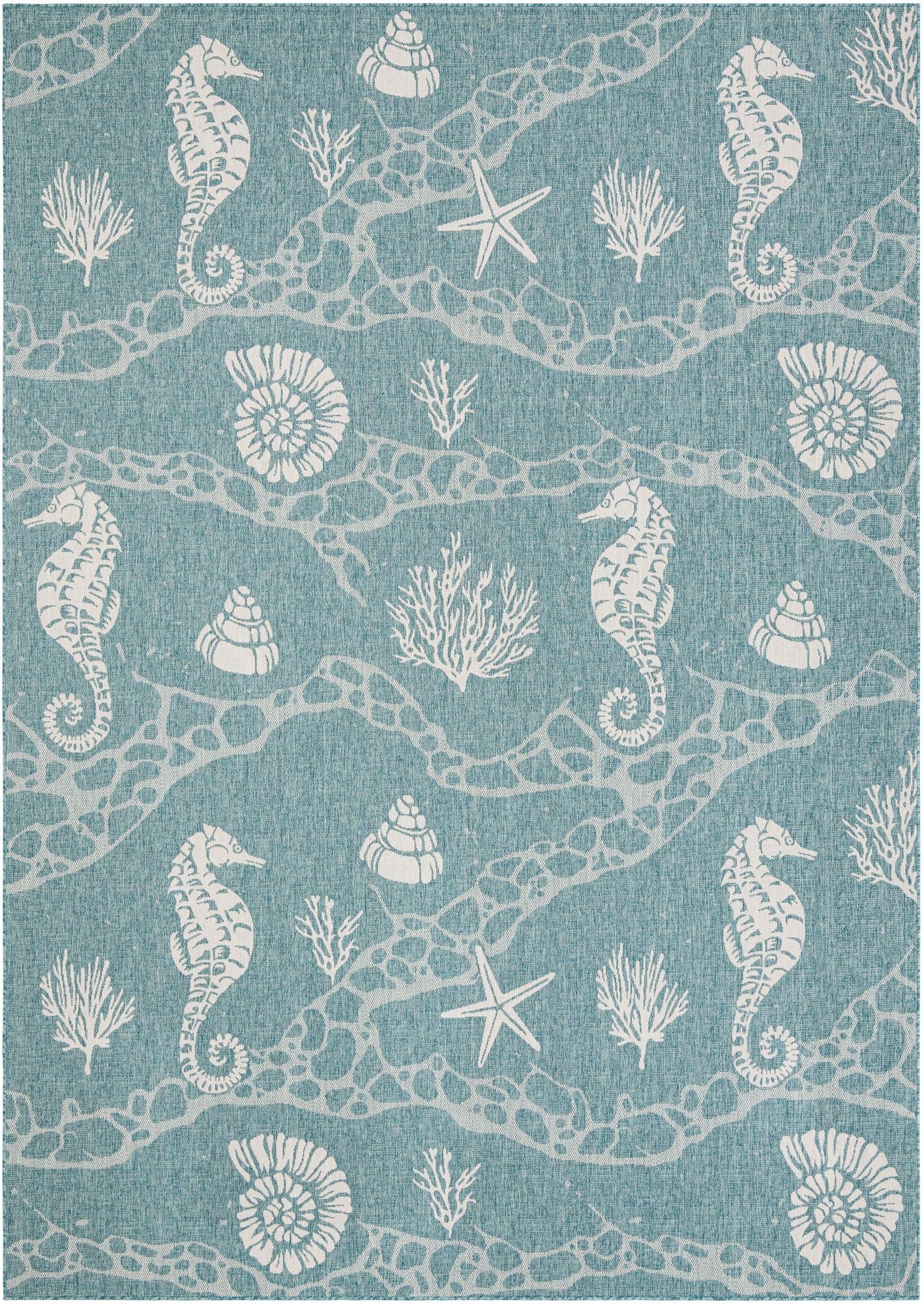 A 10x14 rectangular blue indoor/outdoor rug with a white coastal pattern featuring seahorses, starfish, shells, and coral.