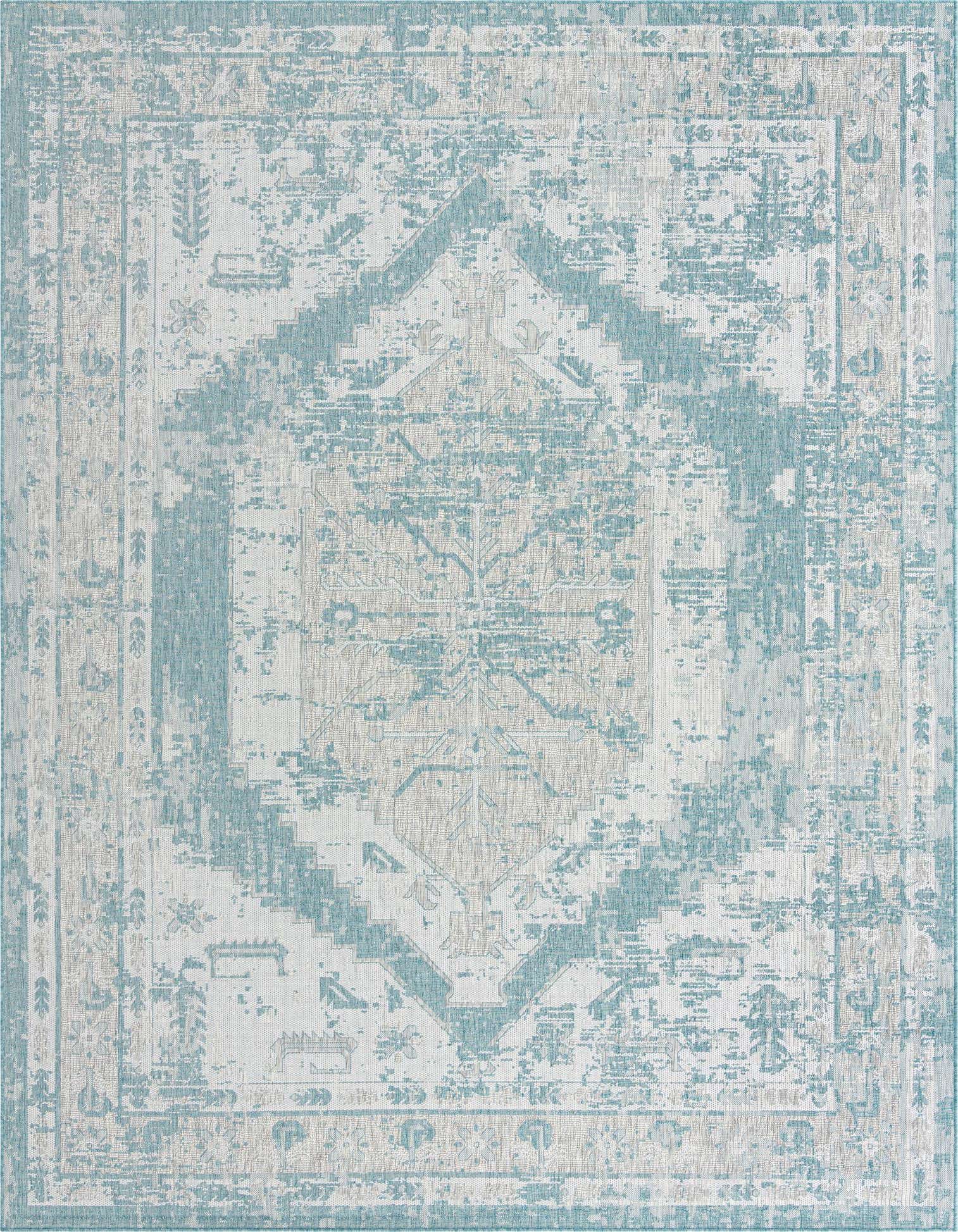 A 10x13 rectangular indoor/outdoor rug featuring a distressed Southwestern pattern in varying shades of blue and white.