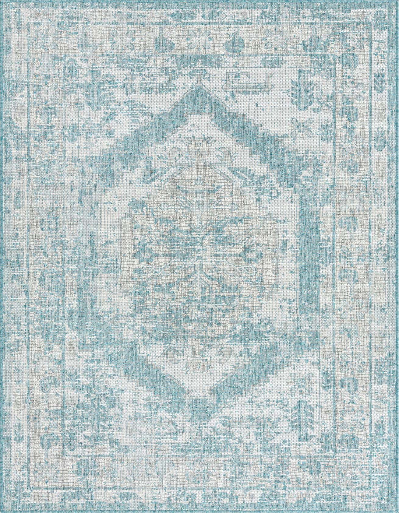 A 5x8 rectangular indoor/outdoor rug featuring a distressed Southwestern medallion pattern in varying shades of blue and white.