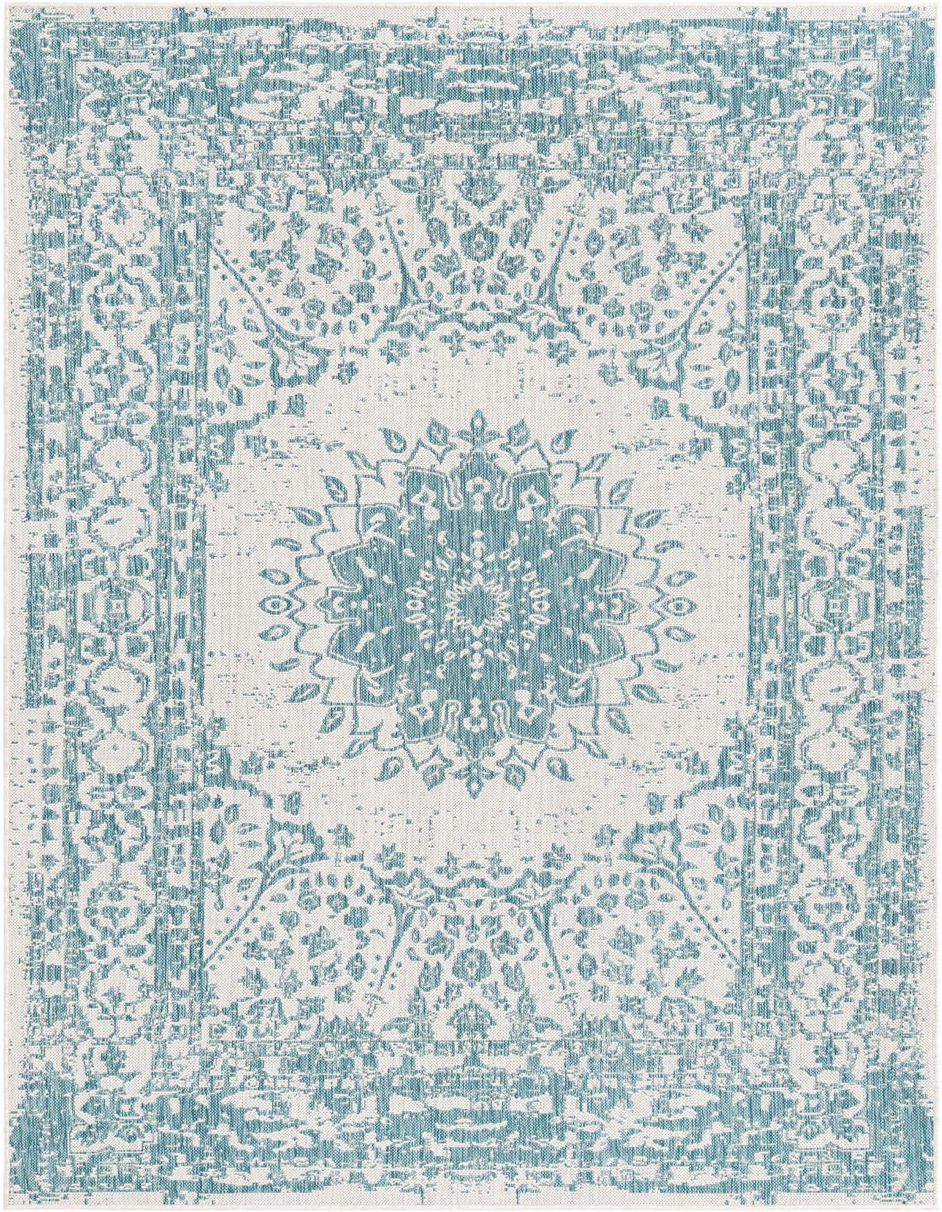 A 6x9 rectangular indoor/outdoor rug featuring a distressed blue medallion and traditional pattern on a light background.
