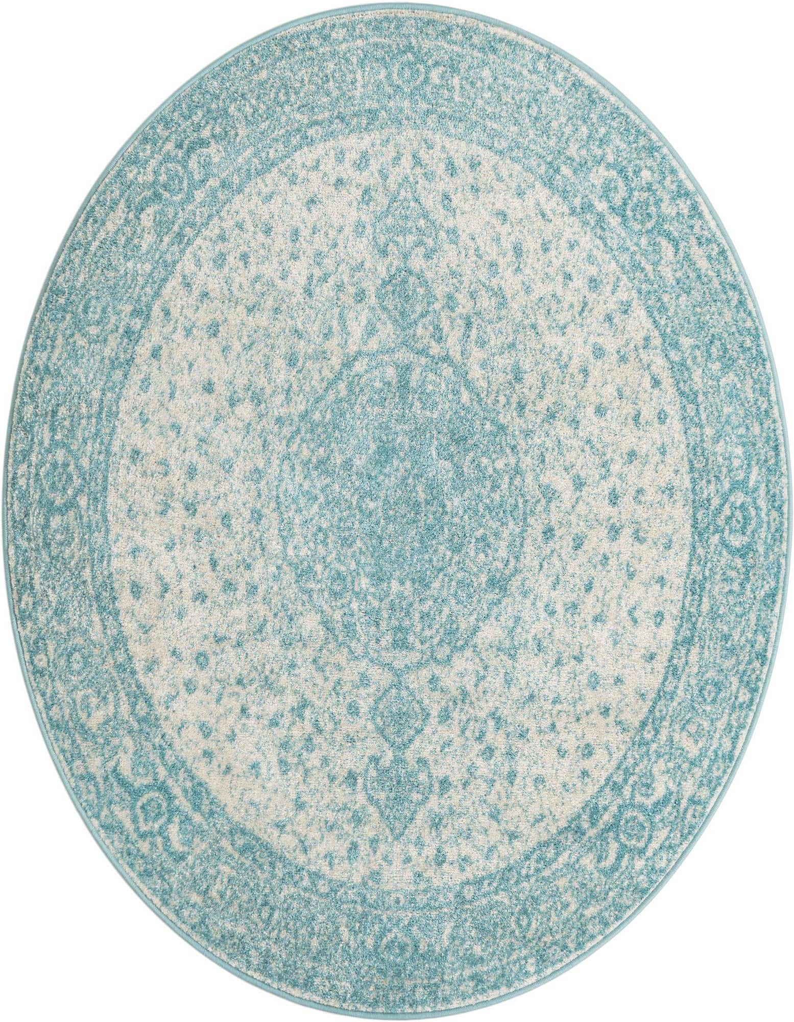 A 5' 3 round blue and cream area rug with a distressed traditional medallion pattern.