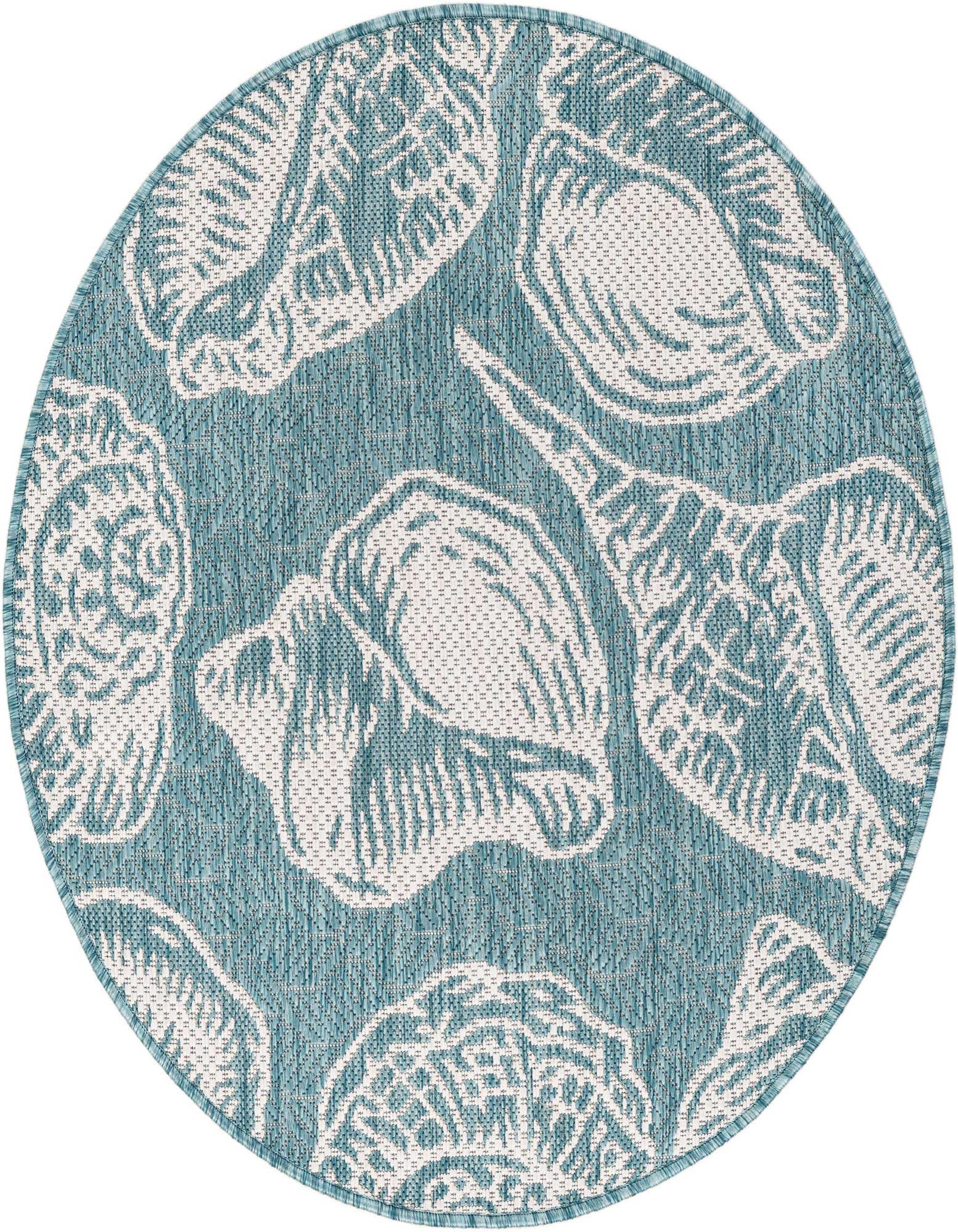 A round blue indoor/outdoor rug with a white seashell pattern, perfect for a patio or beach-themed room.