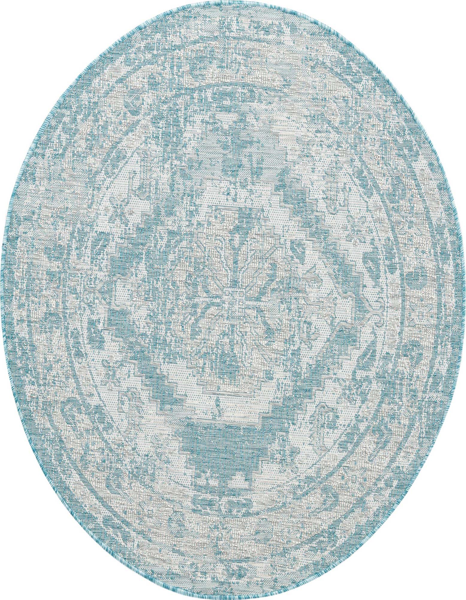 A round 5' 3 x 5' 3 blue and white Southwestern style indoor/outdoor rug with a distressed pattern.