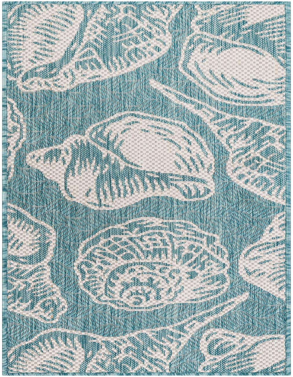 A 4 ft runner rug in blues with a white coastal seashell pattern, suitable for indoor or outdoor use.