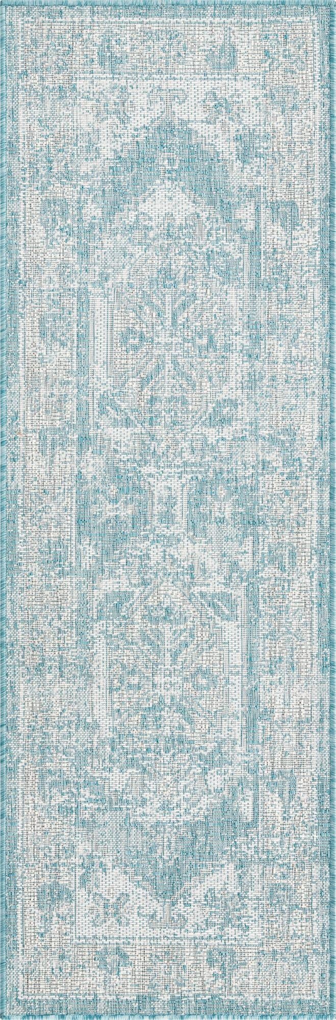 A 6 ft runner rug featuring a distressed vintage blue and white Southwestern pattern, ideal for a hallway or patio.