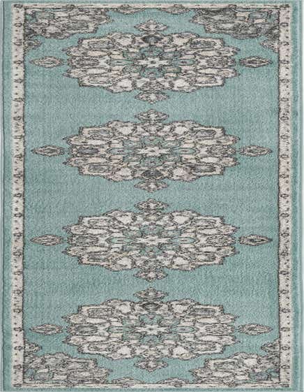 A 12 ft blue runner rug with a repeating vintage medallion pattern in shades of grey and cream, perfect for a hallway.