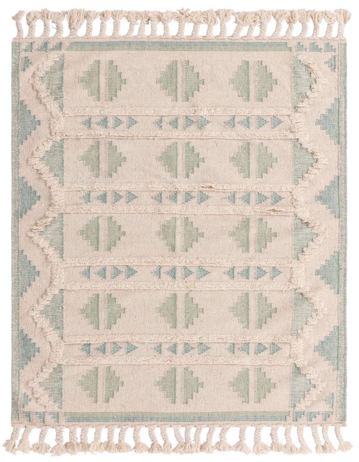 A 5x8 rectangular Aquamarine and White tribal shag rug with geometric patterns and tassels, perfect for a living room.