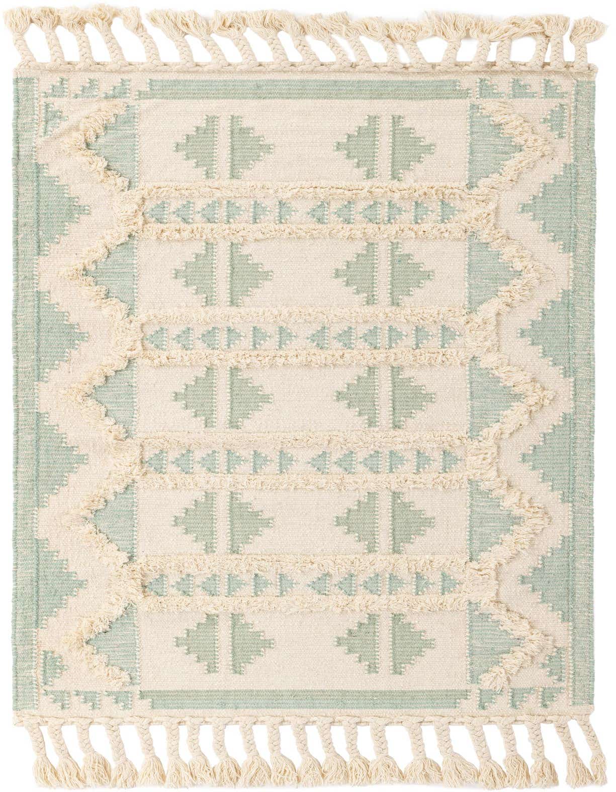 A 4x6 rectangular Rugs.com Arizona rug in aquamarine and white, featuring a tribal pattern with shag texture and tassels.