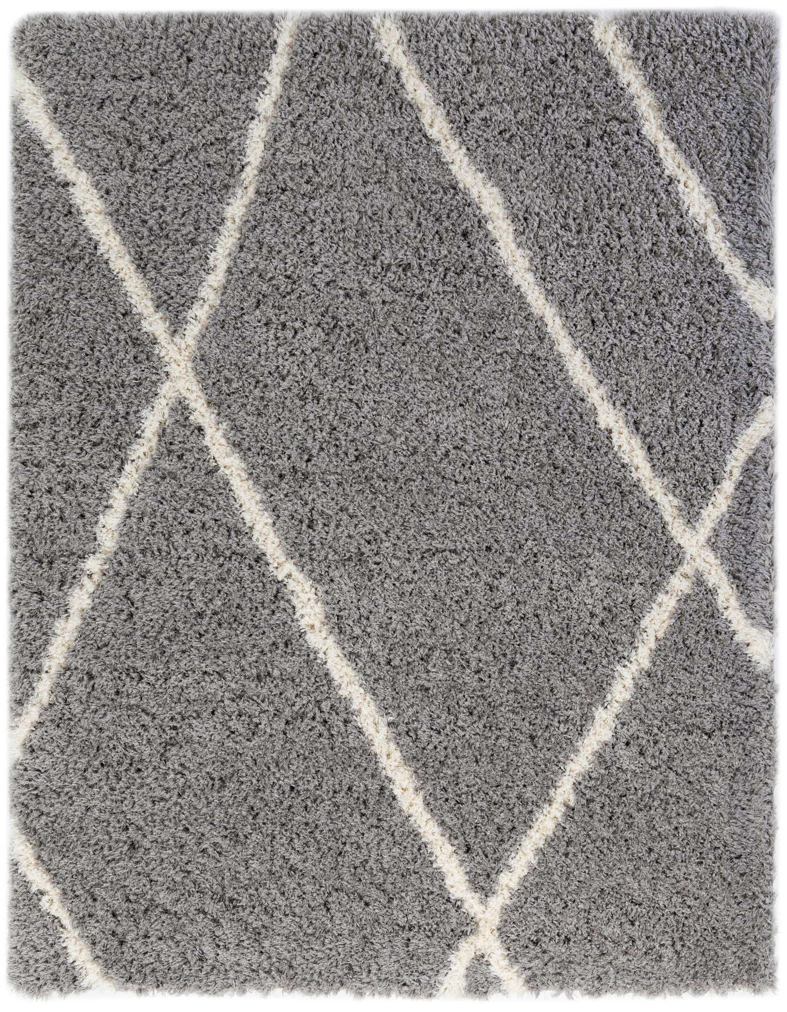 A soft gray shag rug with a modern geometric diamond pattern in off-white, perfect for adding texture.