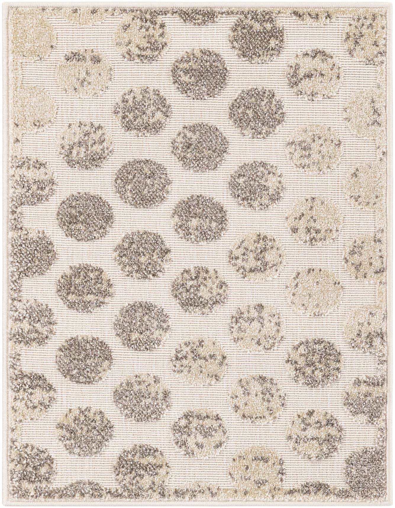 A 2x3 rectangular indoor/outdoor rug featuring a modern abstract pattern of textured ivory and cream polka dots on a white background.