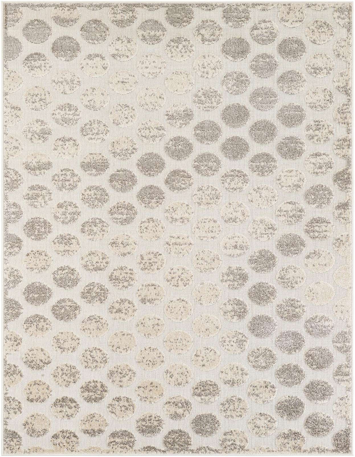 A 5x8 rectangular ivory and cream modern rug with a textured polka dot pattern, suitable for indoor or outdoor spaces.