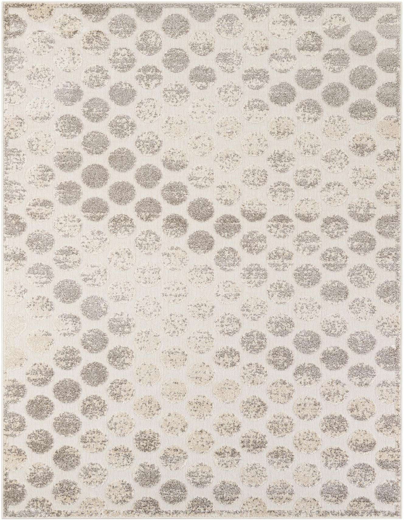 A 6x9 rectangular ivory and cream modern rug with an abstract polka dot pattern, suitable for indoor or outdoor use.