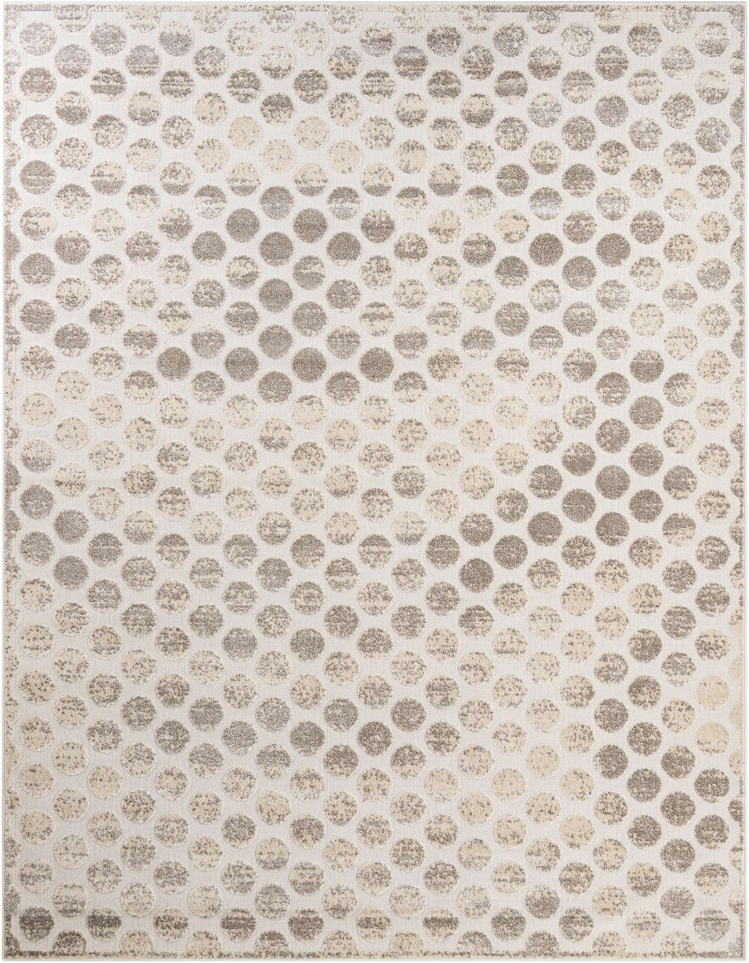 A 9x12 rectangular ivory and cream rug featuring a modern abstract pattern of textured polka dots, suitable for indoor or outdoor use.