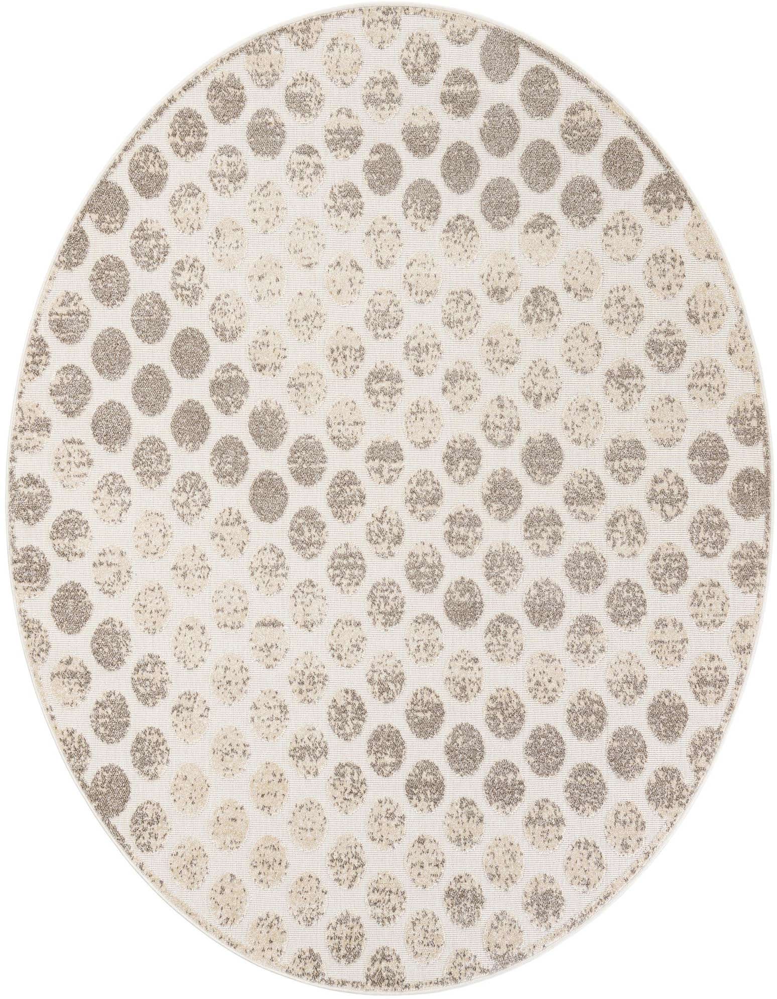 A round ivory and cream rug with a modern abstract polka dot pattern, suitable for indoor or outdoor use.