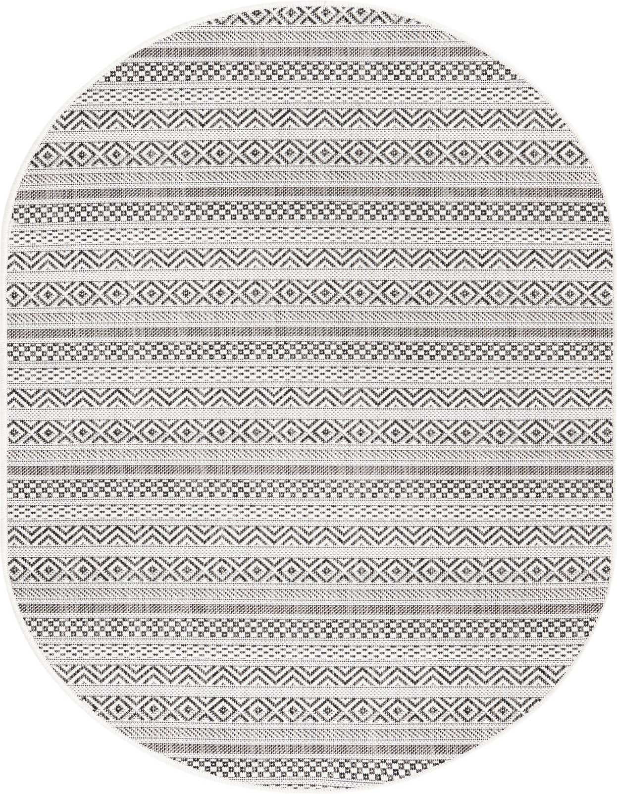 An oval 3' 0 x 5' 3 flatweave rug featuring a modern tribal pattern in browns, tans, and ivories.