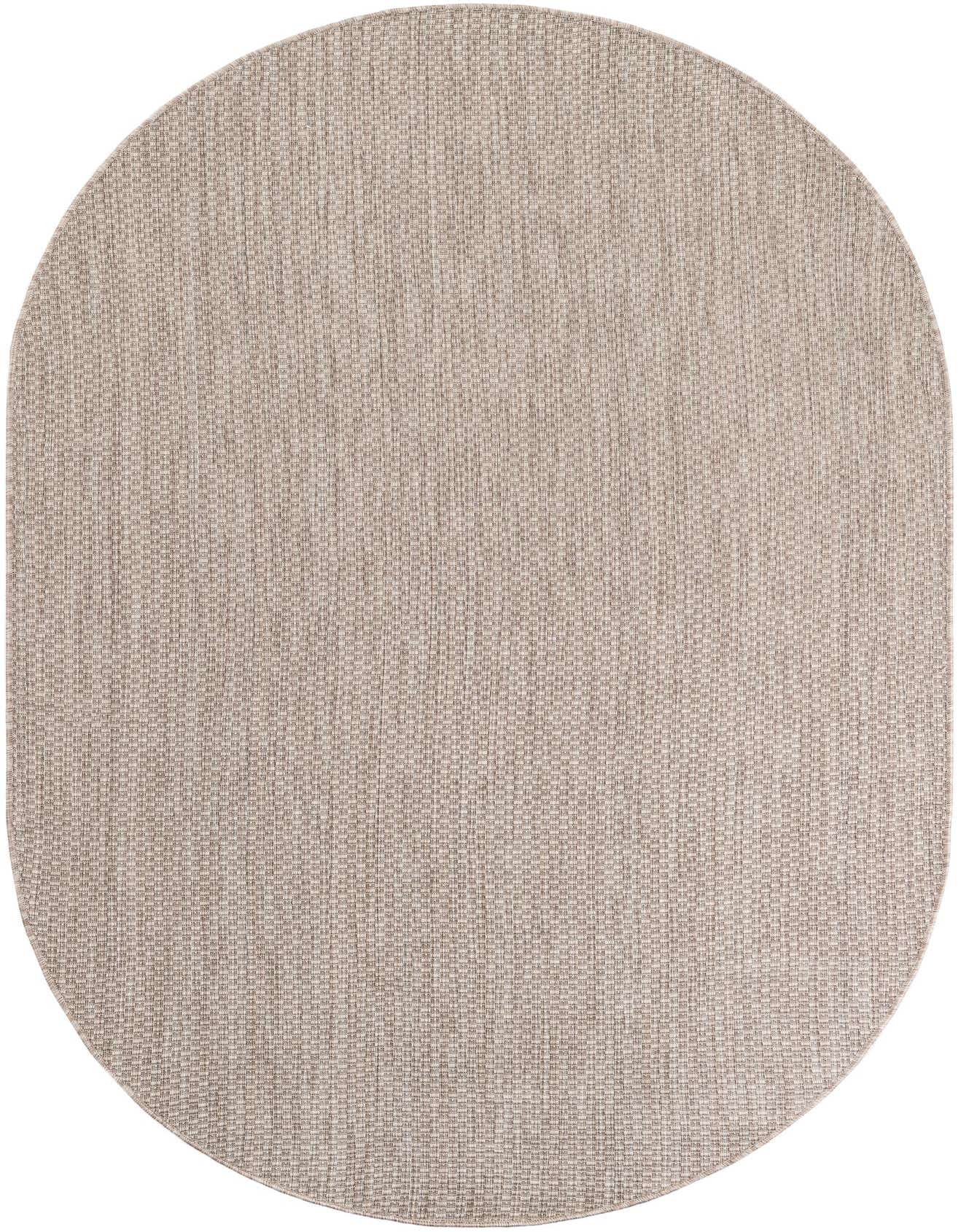 A 5' 3 x 8' 0 oval indoor/outdoor rug in a textured brown and tan flatweave, suitable for a patio.