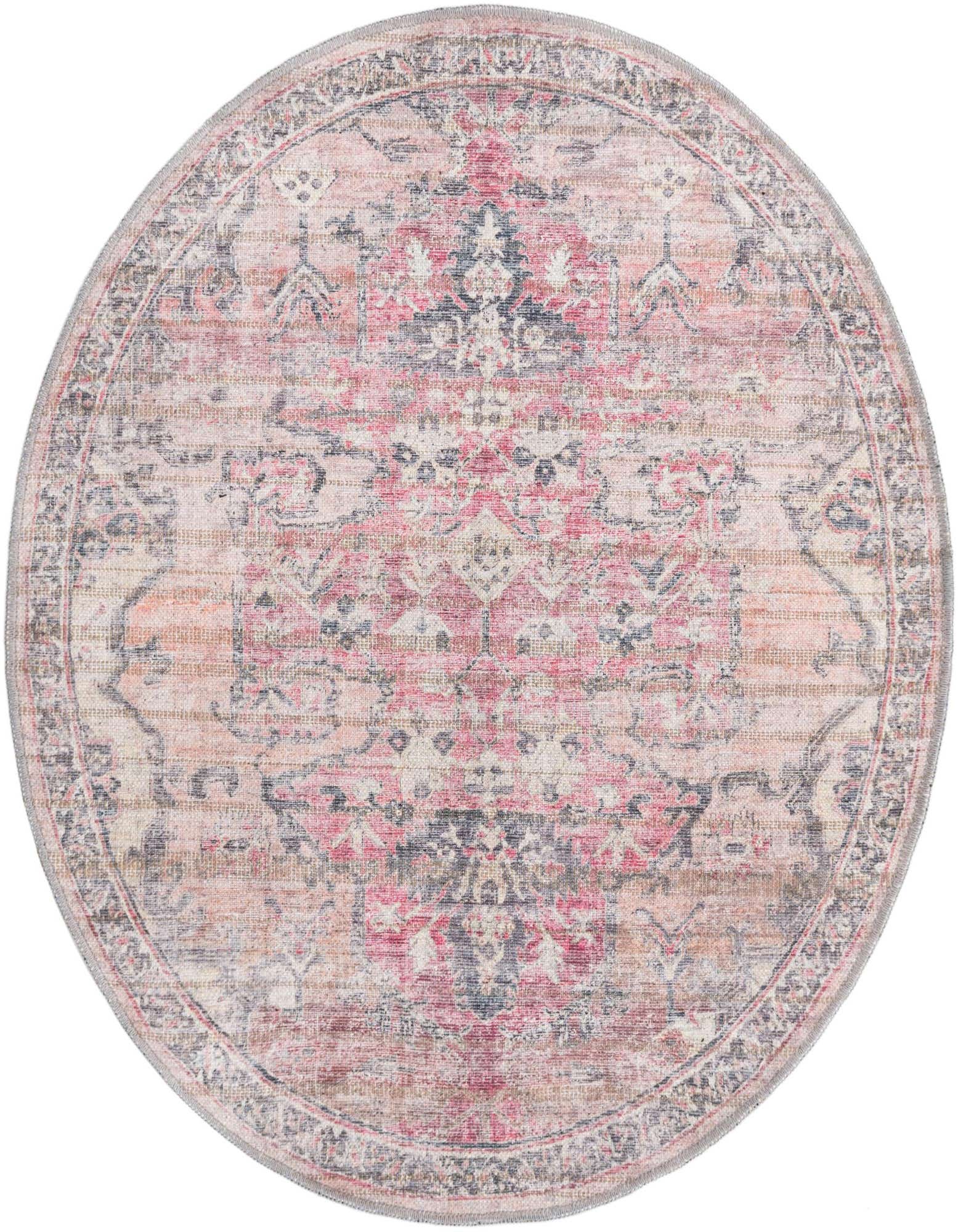 A 4' round beige pink rug with a distressed traditional tribal pattern and a subtle border.