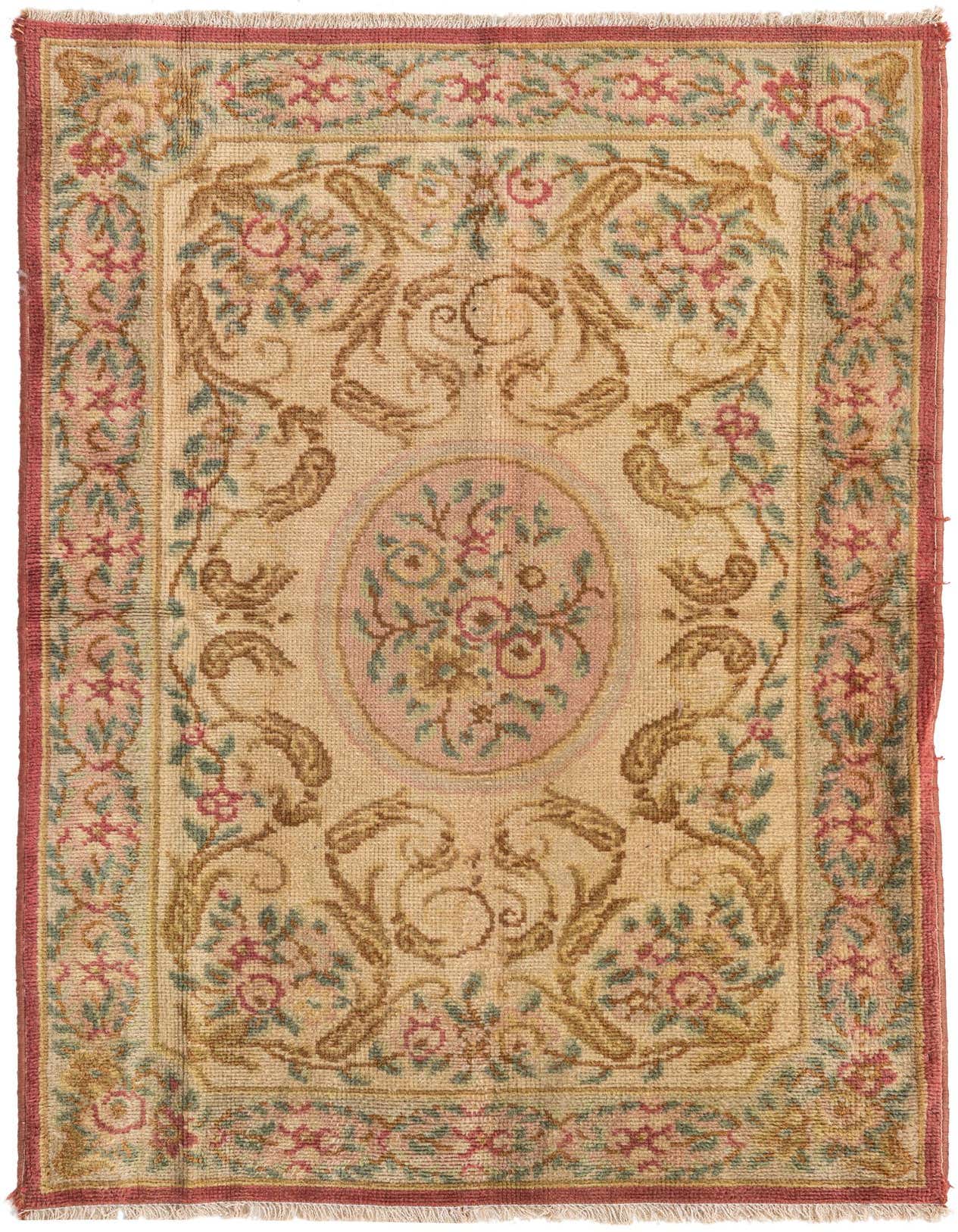 A 3x5 rectangular wool rug featuring an antique floral pattern in browns, tans, and ivories with a pink border.