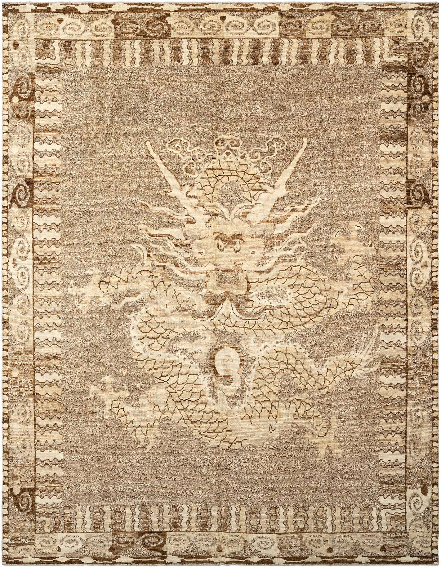 A rectangular handmade wool rug featuring a large, intricate dragon motif in light brown and ivory against a darker tan background, with a detailed border.
