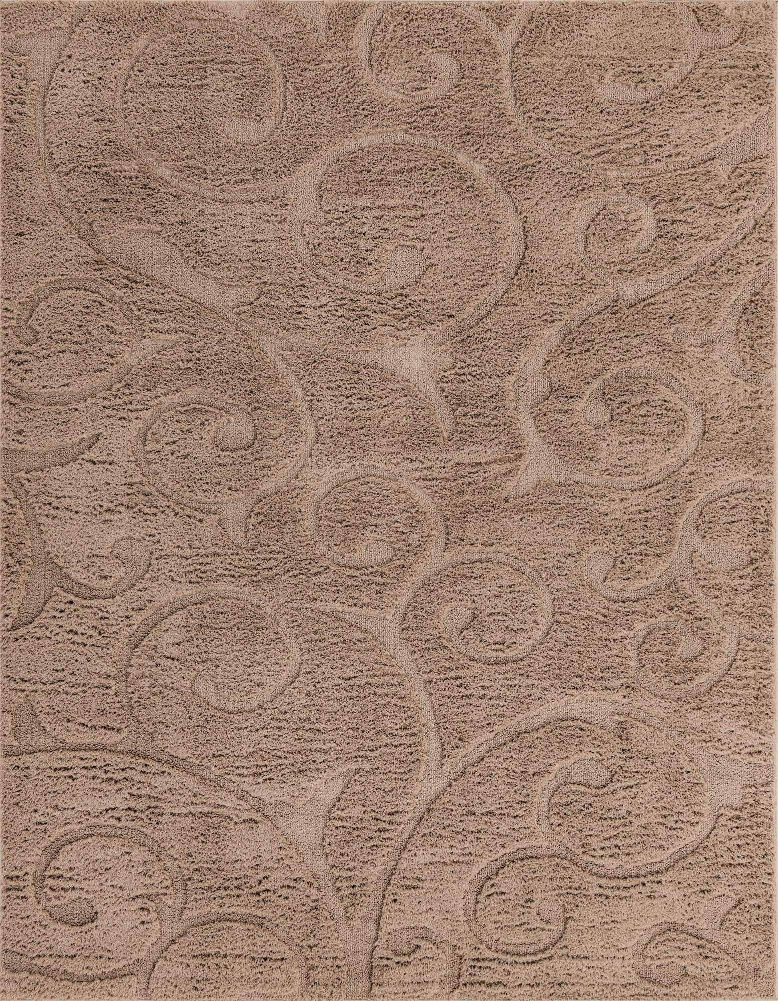 A close-up of an 8x10 rectangular brown and tan shag rug with a subtle raised botanical pattern, featuring high and low pile textures.