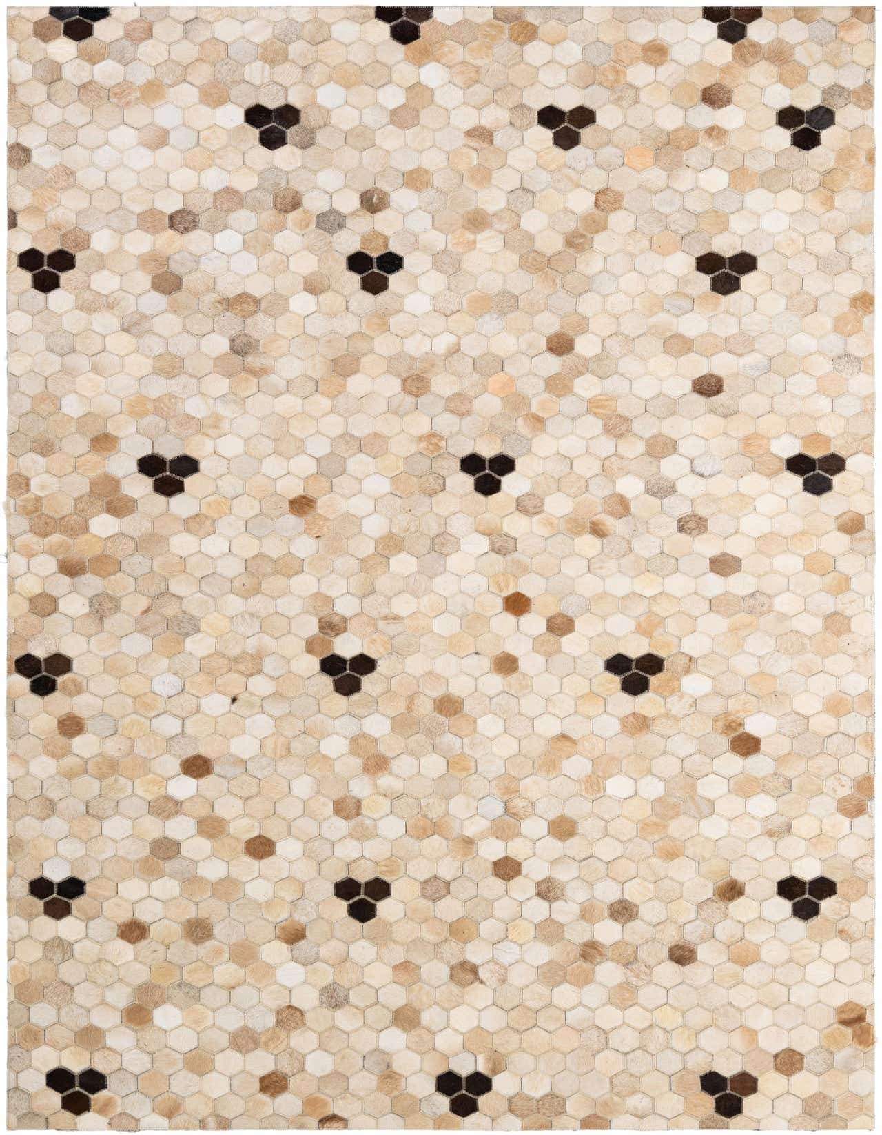 A 5x8 rectangular Cowhide Patchwork rug featuring a modern honeycomb pattern in varying shades of brown, tan, and ivory, with dark brown accents.