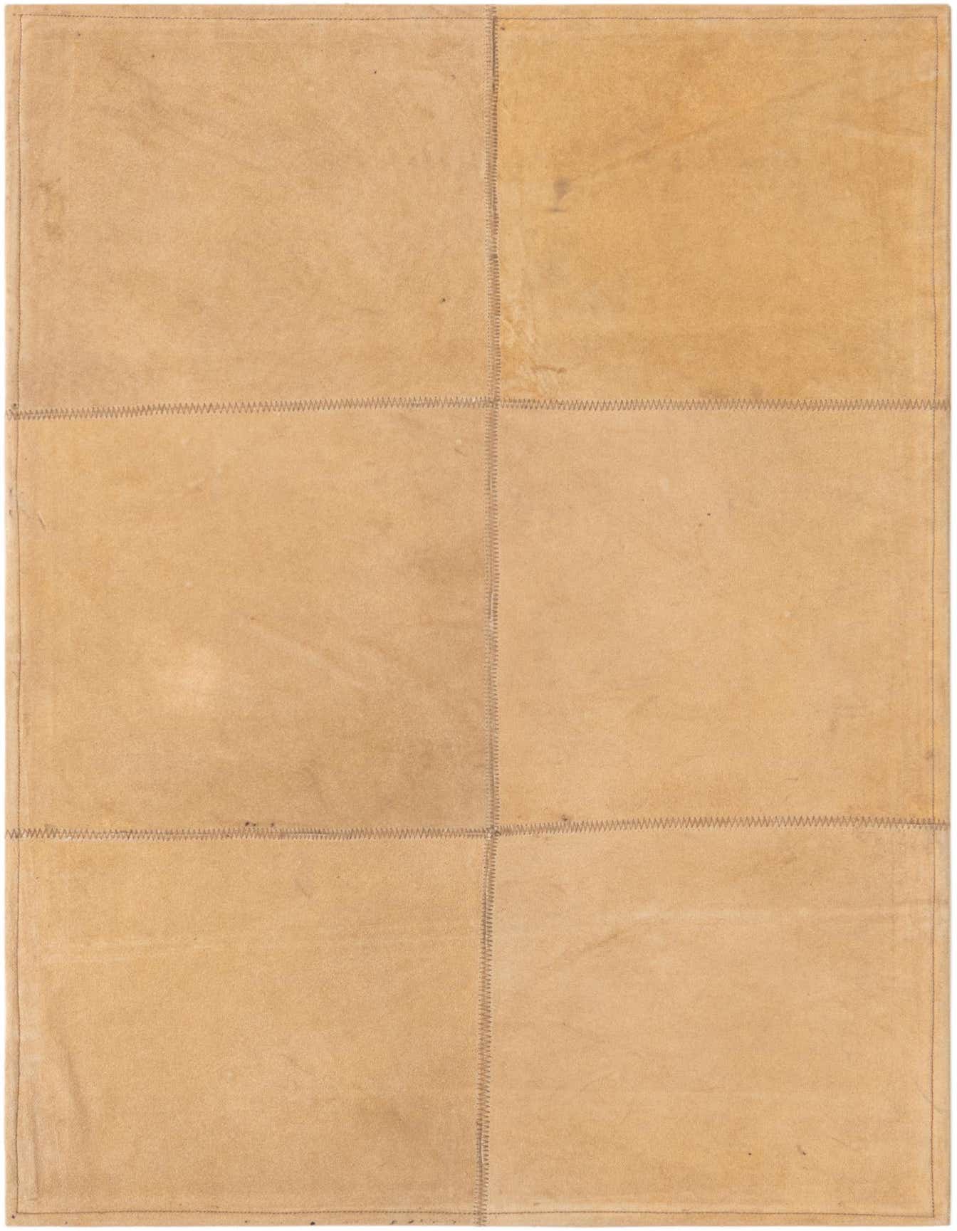 A 2x3 rectangular Rugs.com Cowhide Leather rug in shades of brown and tan, featuring a modern patchwork design with visible stitching, ideal for a kitchen or entryway.