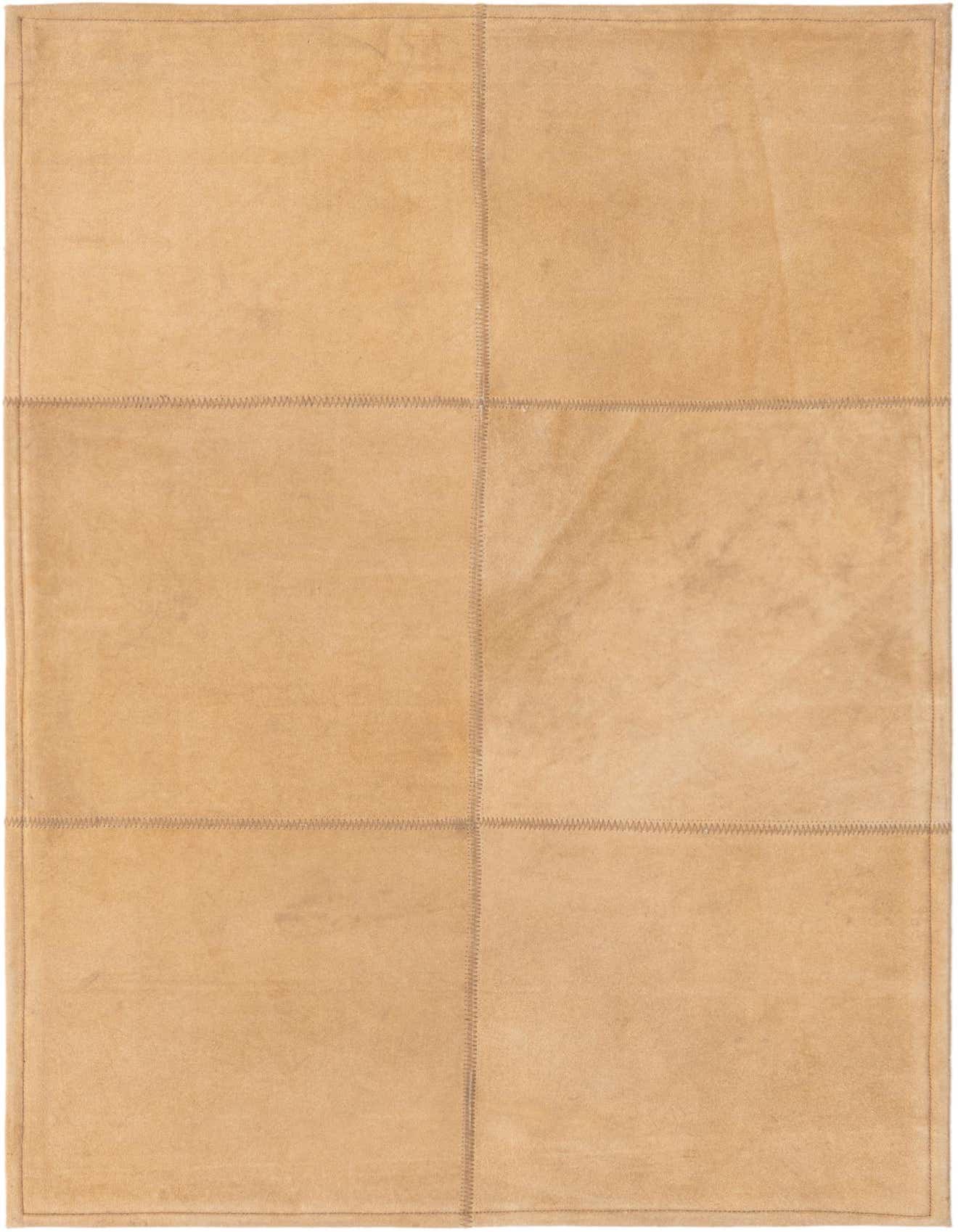 A 2x3 rectangular Rugs.com Cowhide Leather rug in shades of brown and tan, featuring a modern patchwork design with visible stitching, ideal for an entryway.