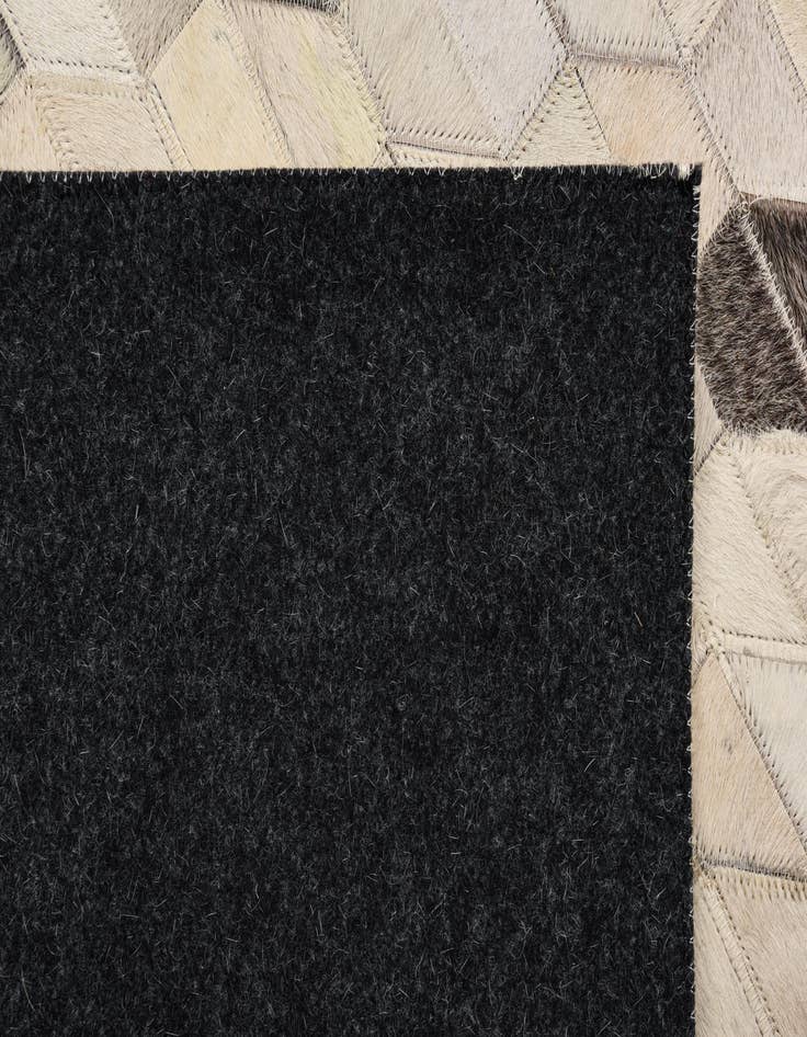 Detail image of  5' 4 x 7' 7 Cowhide Rug