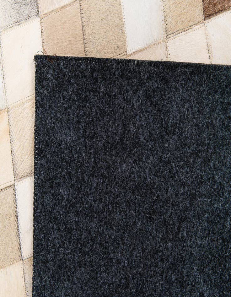 Detail image of  4' 11 x 7' 10 Cowhide Stocks Rug