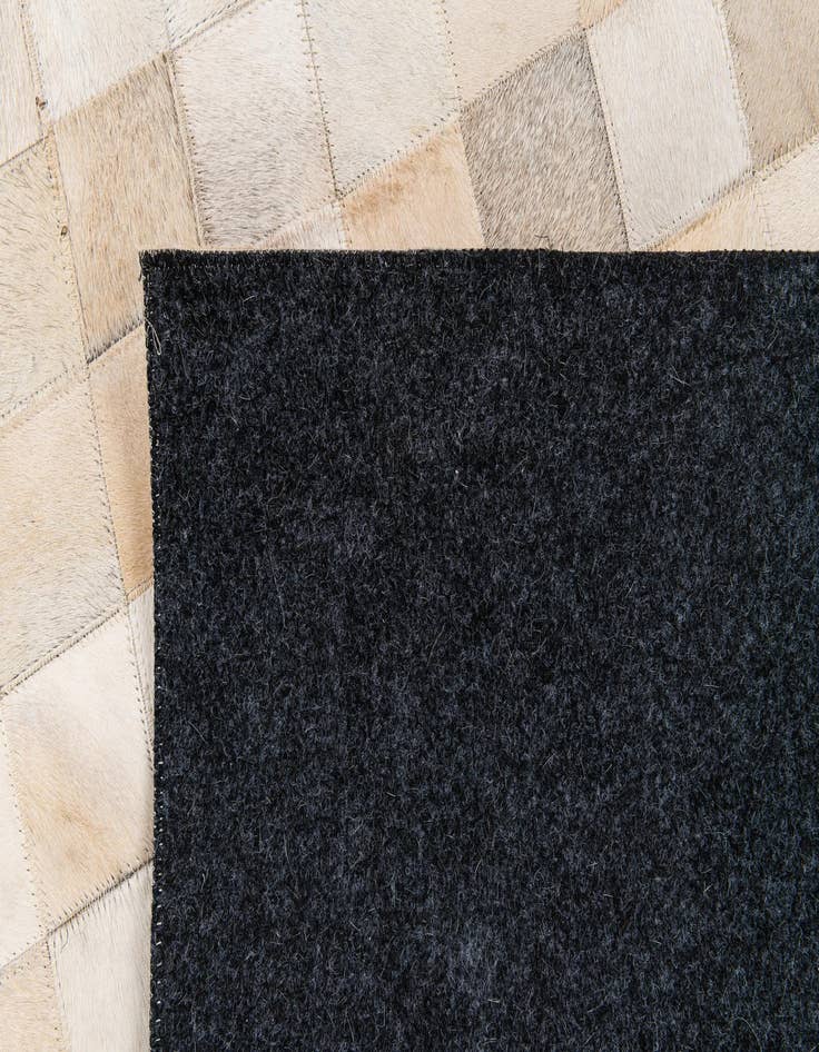 Detail image of  4' 11 x 7' 10 Cowhide Stocks Rug
