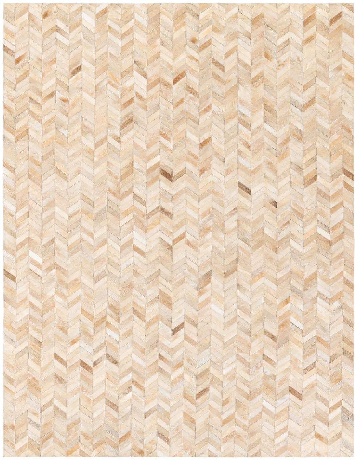 A 5x8 rectangular Cowhide Stocks rug from Rugs.com, featuring a modern chevron pattern in varied shades of brown, tan, and cream.
