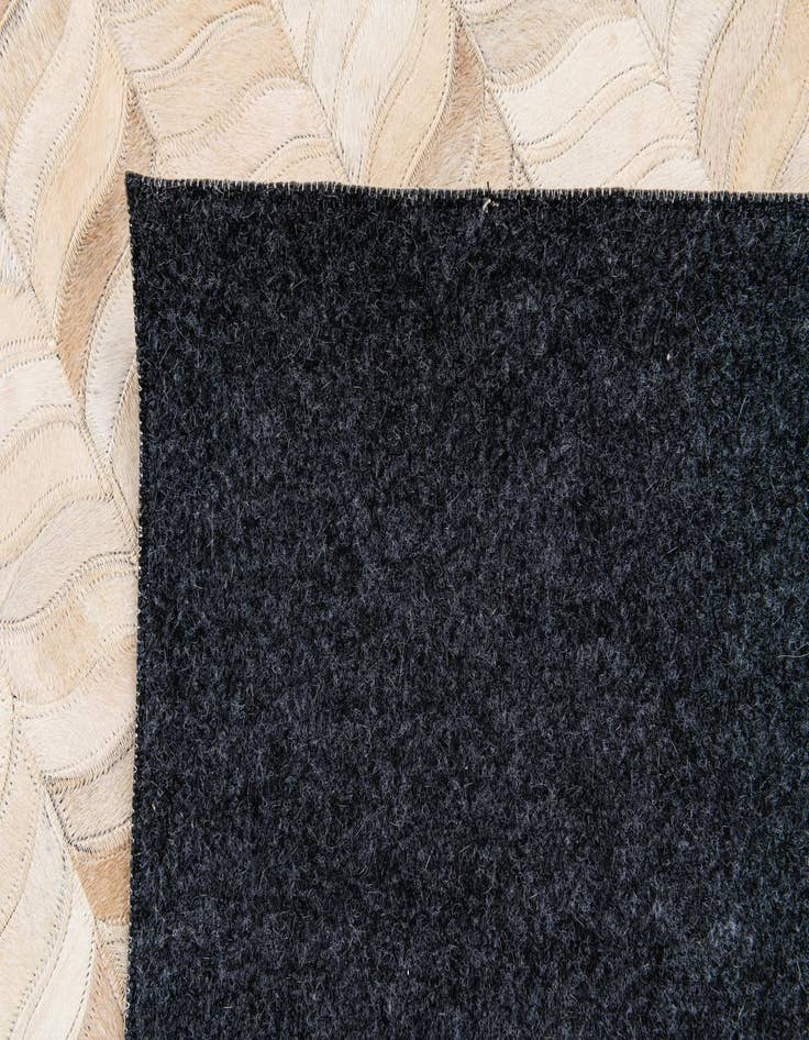 Detail image of  6' 8 x 9' 9 Cowhide Stocks Rug