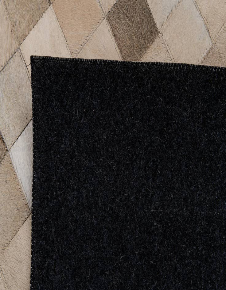 Detail image of  6' 8 x 9' 9 Cowhide Stocks Rug