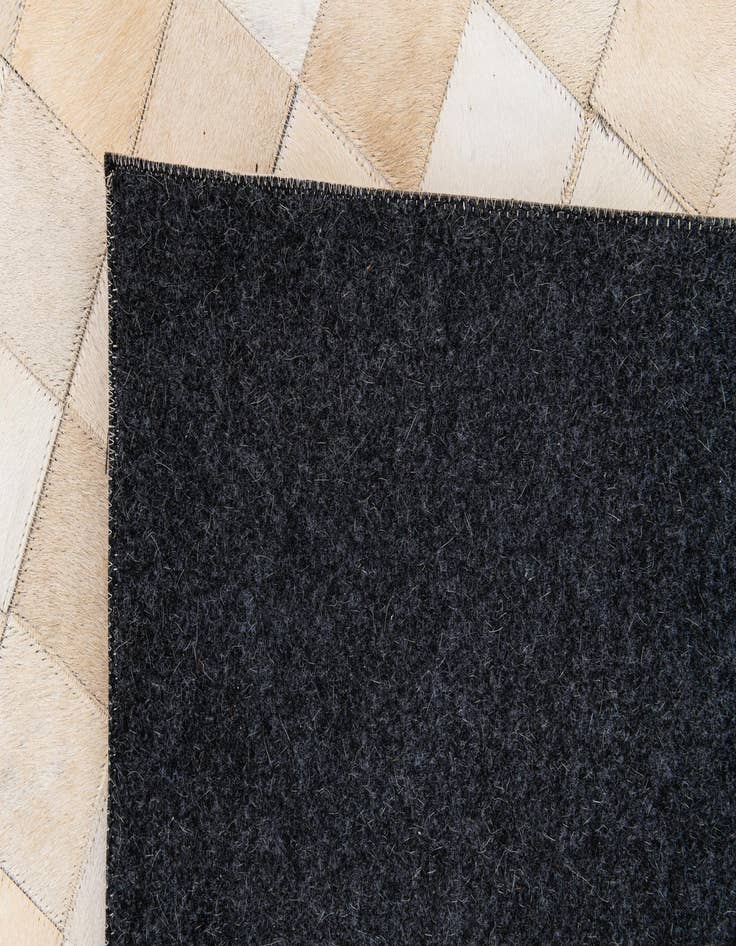 Detail image of  6' 8 x 9' 11 Cowhide Stocks Rug