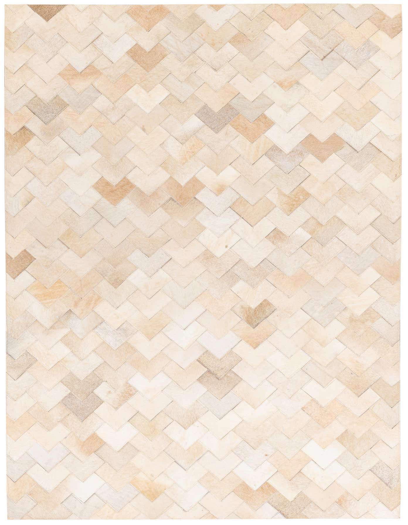 A 4x6 rectangular cowhide rug featuring a modern chevron pattern in varying shades of brown, tan, and ivory.