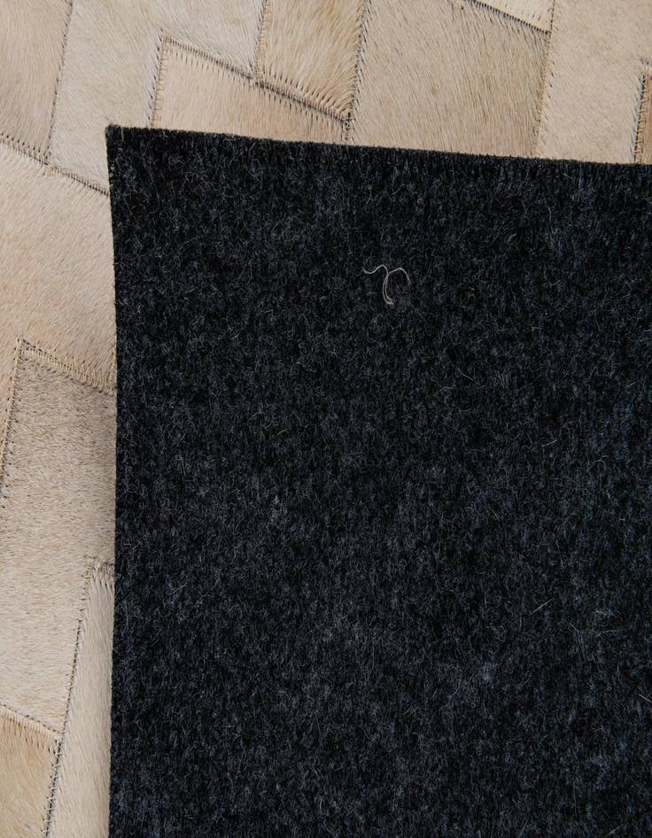 Detail image of  4' 1 x 5' 10 Cowhide Stocks Rug