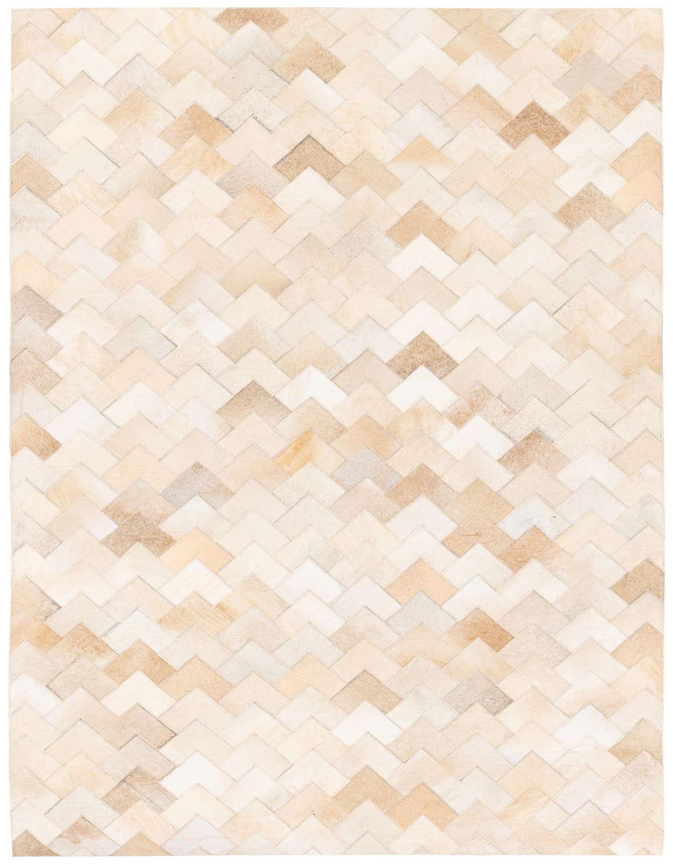 A 4x6 rectangular Cowhide Stocks rug featuring a modern chevron pattern in various shades of brown, tan, and cream.