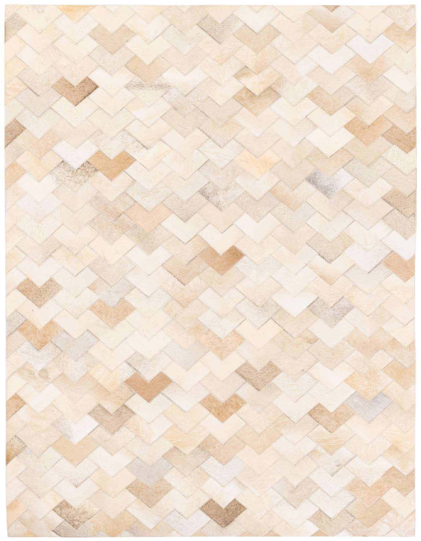 A 4x6 rectangular Cowhide Stocks rug featuring a modern chevron pattern in various shades of brown, tan, and cream.