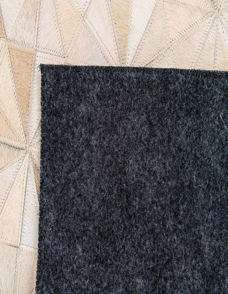 Detail image of  3' 11 x 6' Cowhide Stocks Rug