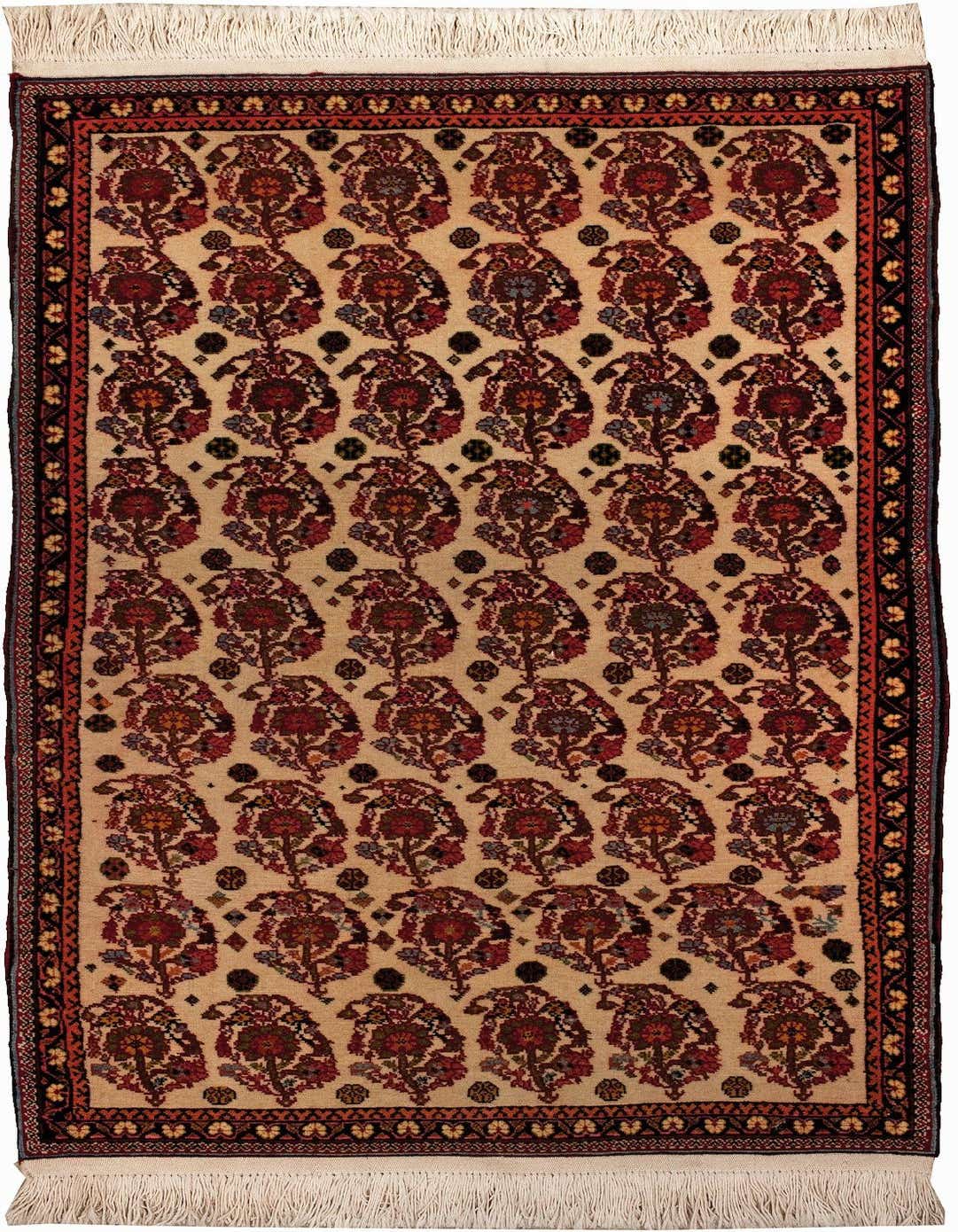 A 2x3 rectangular Gabbeh rug featuring a modern pattern of repeated floral motifs in browns, tans, and creams, with a dark border.