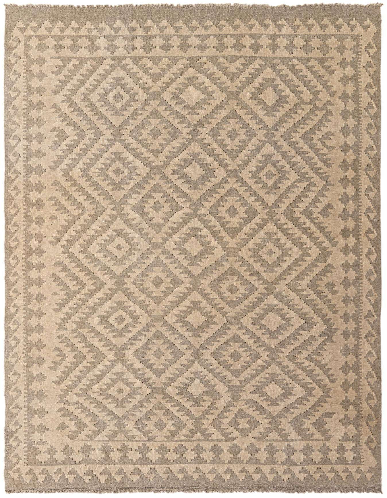 A rectangular 6x9 Kilim Maymana rug featuring a tribal geometric pattern in brown and cream tones.