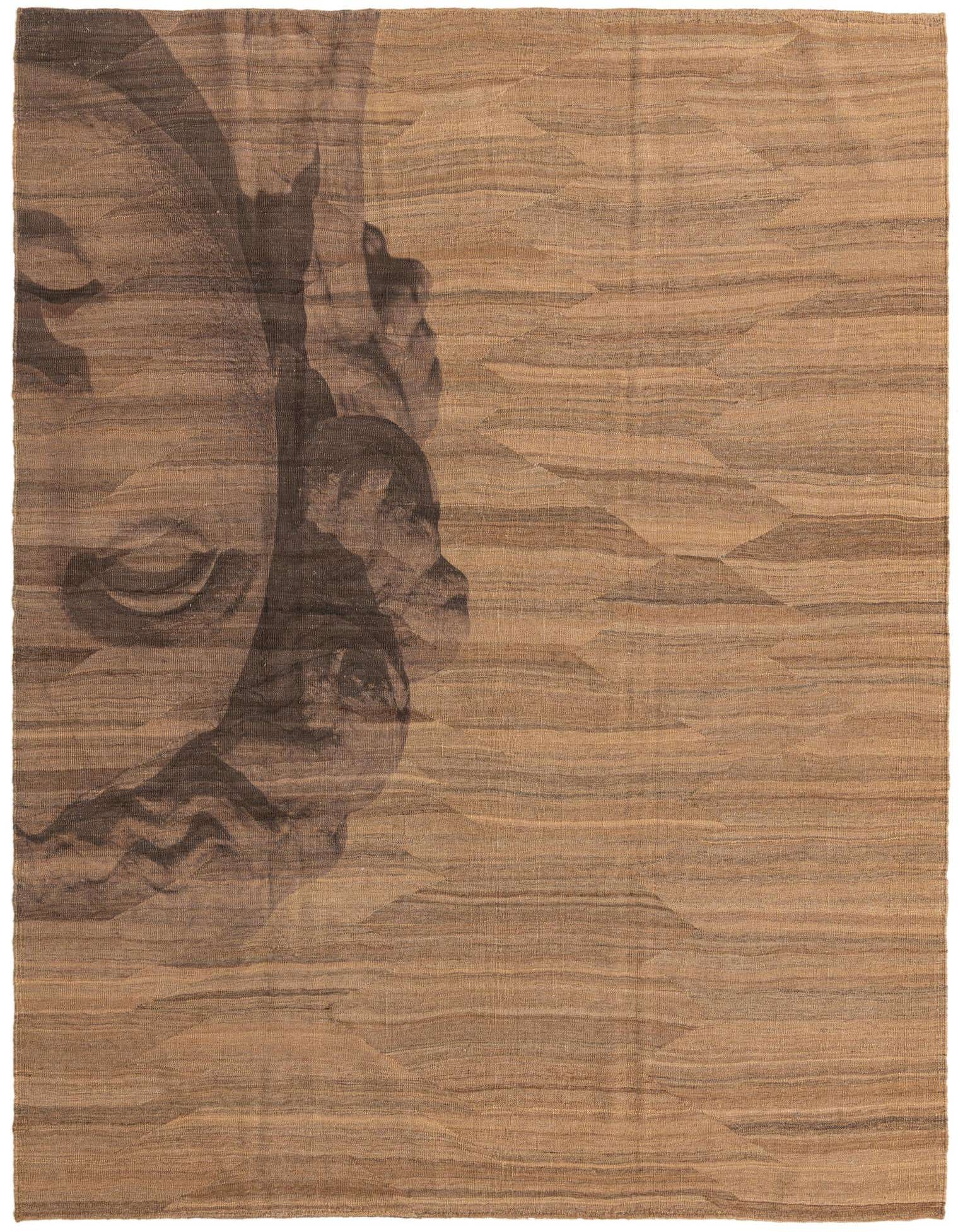 A 7x10 rectangular brown and tan Kilim Modern rug featuring a large, abstract tribal face design on a flatweave wool texture.