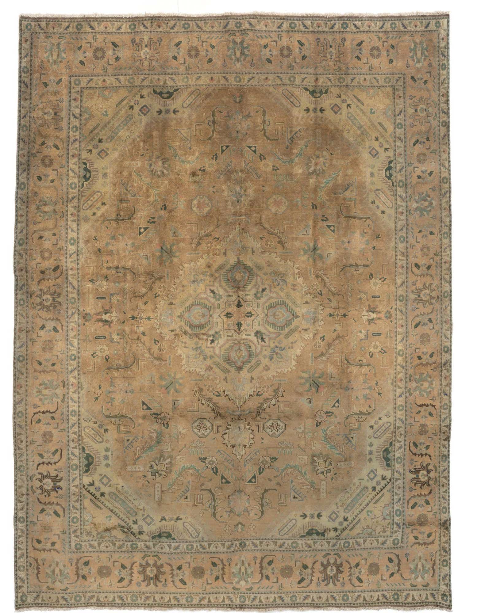 A 10x13 rectangular Mashad Persian rug in muted browns, tans, and ivories, featuring an intricate floral medallion pattern.