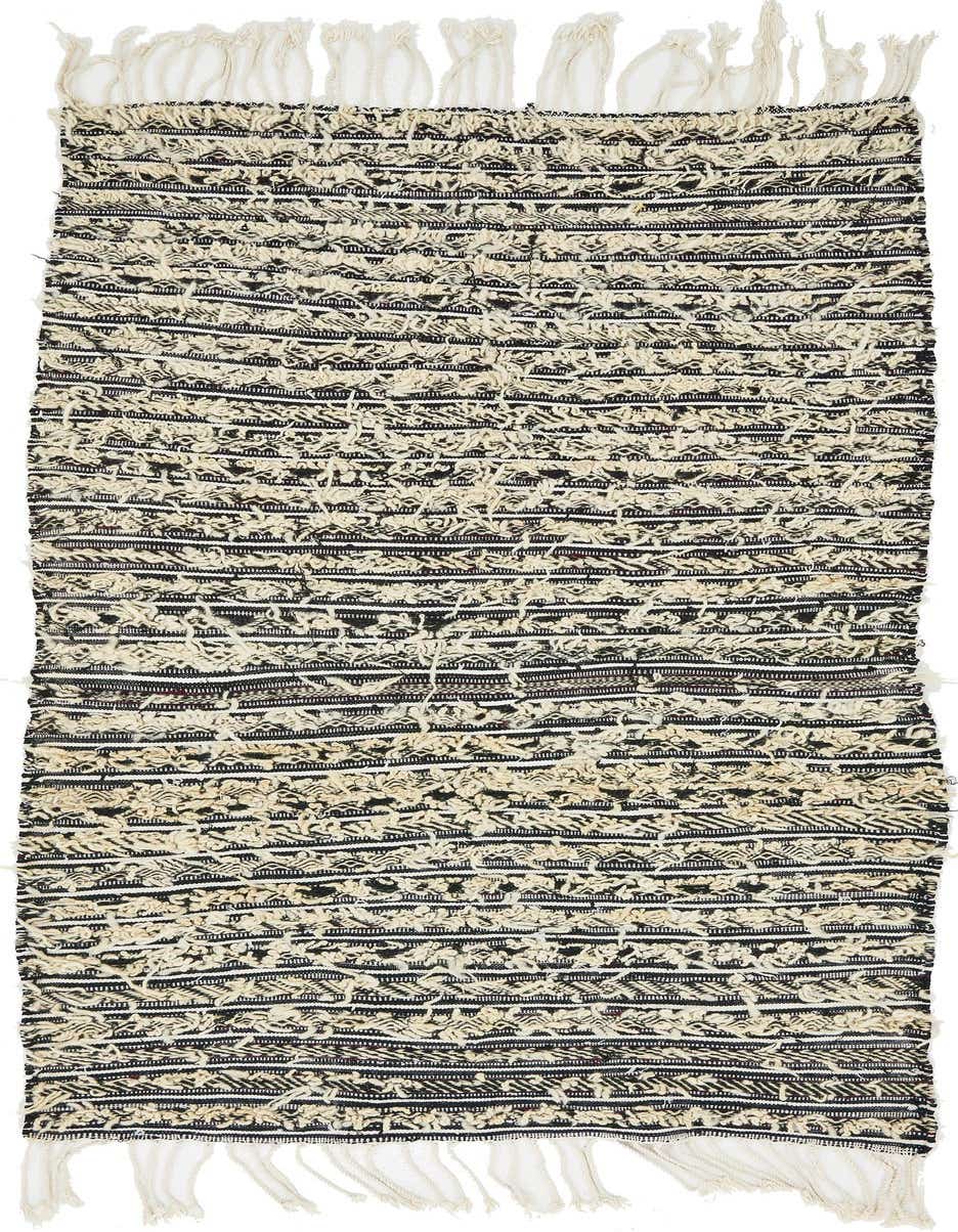 A 4x6 rectangular Moroccan shag rug in brown and ivory with tribal stripes and fringe.