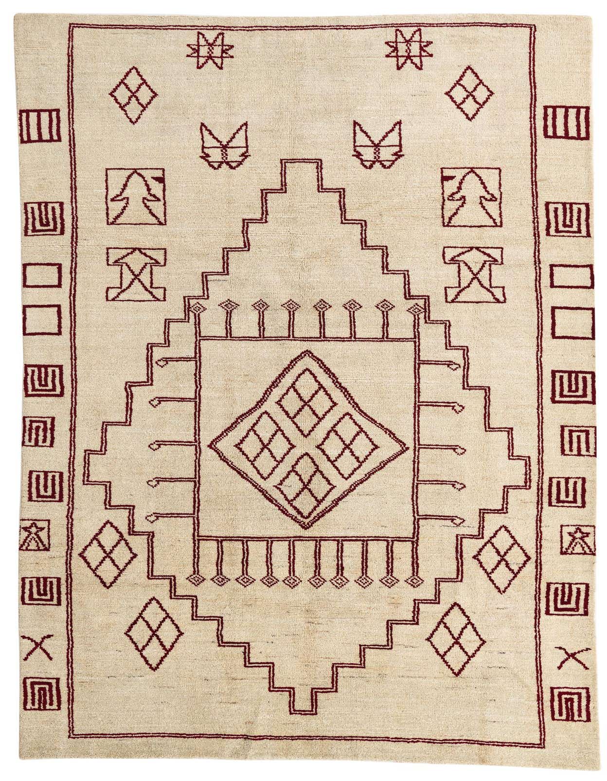 A 6x9 rectangular Moroccan shag rug with a cream background and rich brown tribal patterns, perfect for a living room.