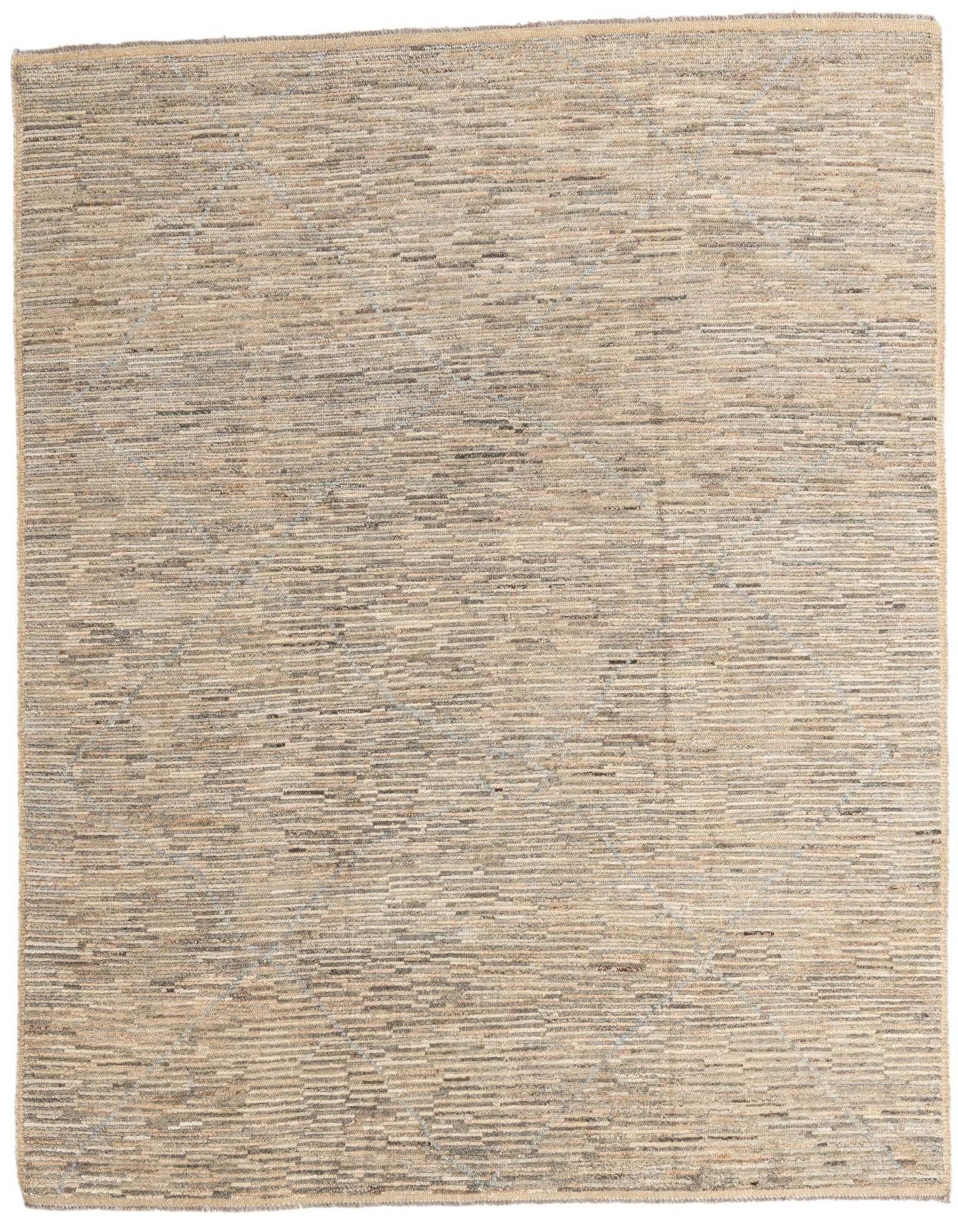 A rectangular 8x10 Moroccan shag rug in browns, tans, and ivories, featuring a subtle abstract tribal pattern.