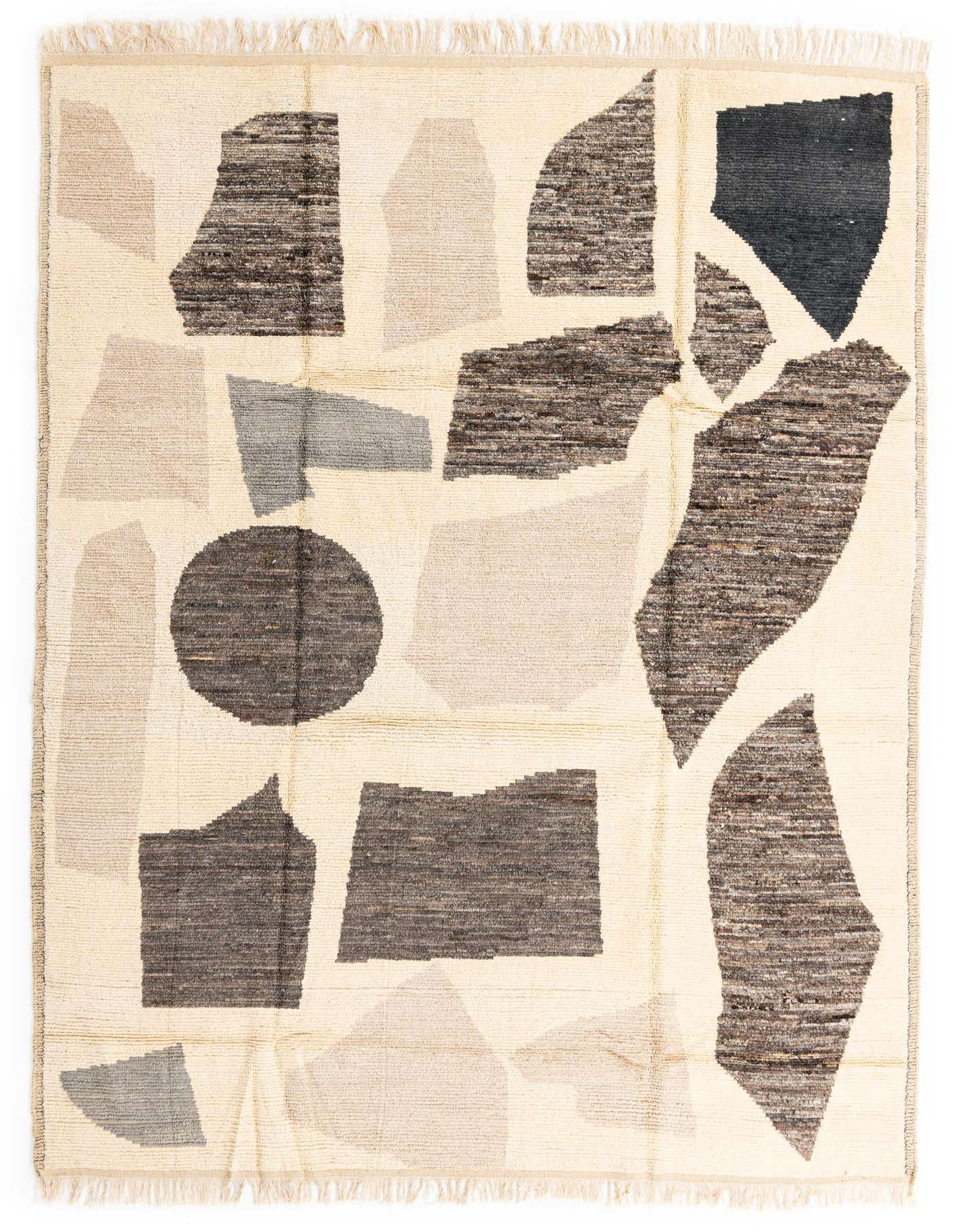 A 9x12 rectangular Moroccan shag rug with an abstract pattern in shades of brown, tan, and cream.